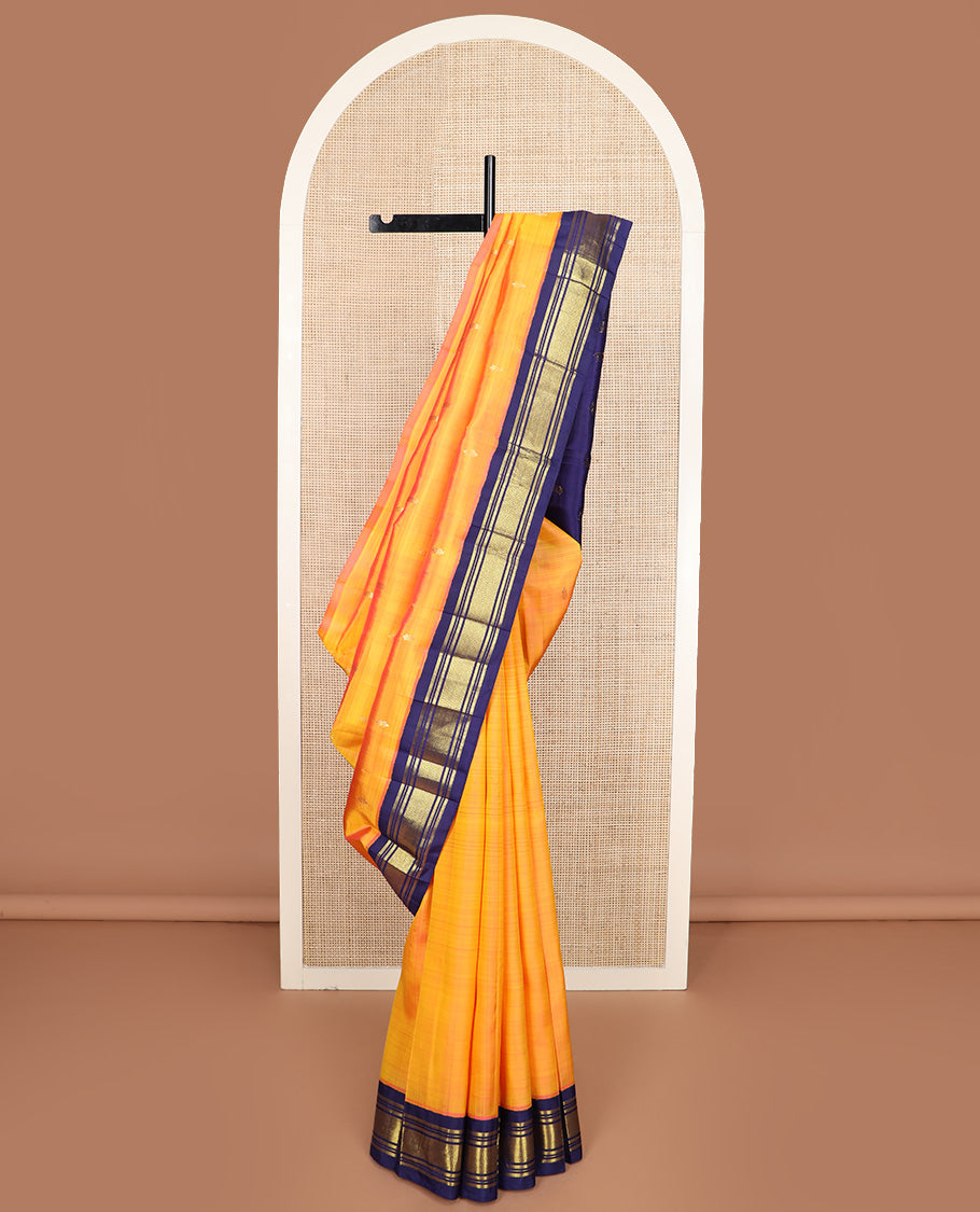 Yellow zari buttas Kanchipuram silk saree, contrast korvai border of banaras, muthu, and jaal design, and zari design pallu