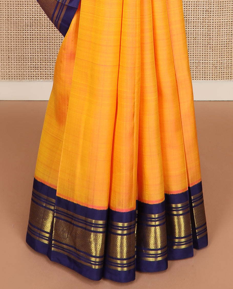 Yellow zari buttas Kanchipuram silk saree, contrast korvai border of banaras, muthu, and jaal design, and zari design pallu