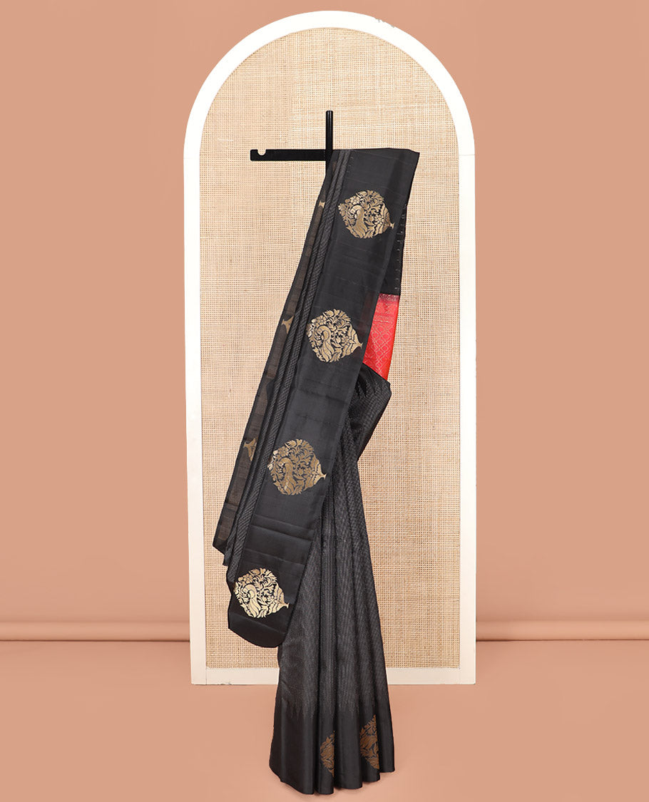 Black Kanchipuram Silk Saree Delicately Woven with Muthu Designs on Its Body, Subtly Sparkled Border of Bird and Floral Designs, Captivating Contrast Pallu of Jaal Designs, and Paired with a Contrast Blouse