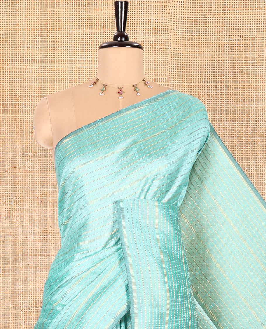 Borderless Turquoise Semi-Raw Silk Saree Gleamed Up with Gold-Zari Horizontal Stripes All Over Its Body, Complemented by a Contrast Pallu of Stripes, and Paired with a Contrast Blouse