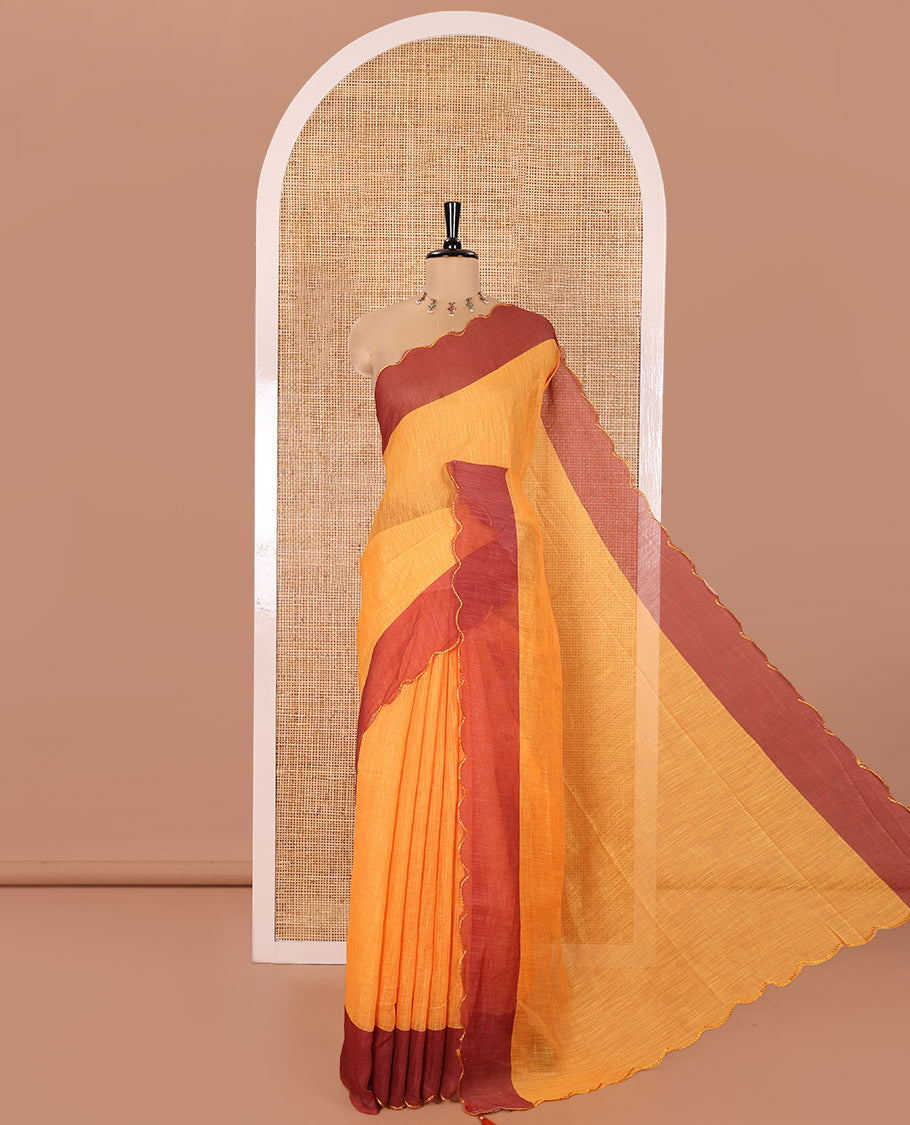 Yellow Plain Linen Cotton Saree, Complemented by Contrast Scallop Border, Plain Pallu, and Paired with a Contrast Floral Printed Mirror Embroidered Blouse
