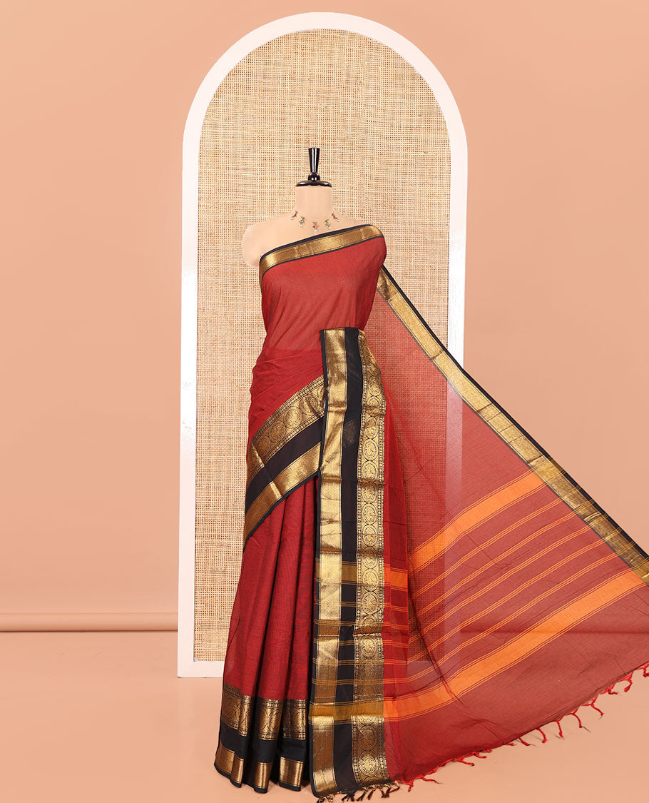 Maroon Plain Chettinad Cotton Saree, Complemented by Contrast Traditional Zari Border of Round Peacock Designs, Subtly Striped Pallu, and Paired with a Matching Blouse