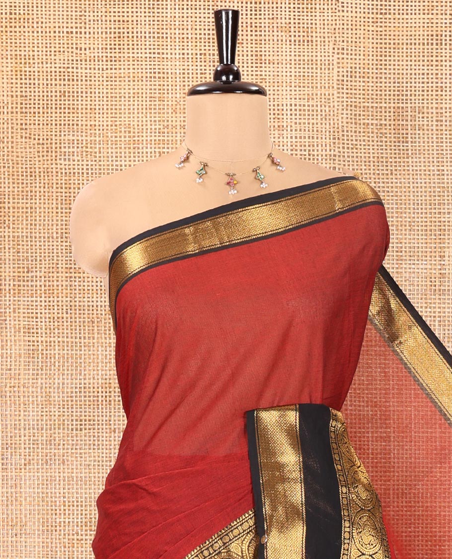 Maroon Plain Chettinad Cotton Saree, Complemented by Contrast Traditional Zari Border of Round Peacock Designs, Subtly Striped Pallu, and Paired with a Matching Blouse