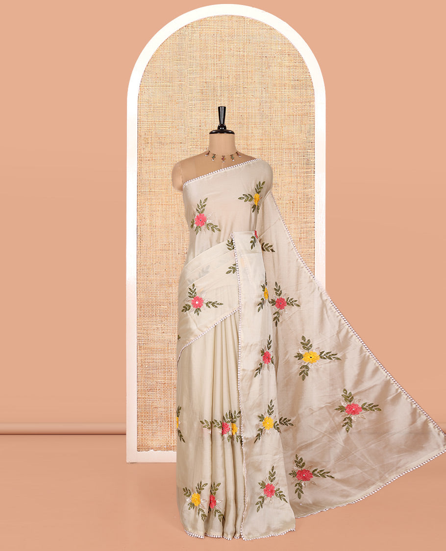 Light Grey Rangoli Chiffon Saree, Artfully Embroidered with Floral Motifs in Thread and Stone Work On Its Body, Subtly Sparkled with Lace Border, a Self-Pallu, and Paired with a Contrast Floral Embroidered Blouse