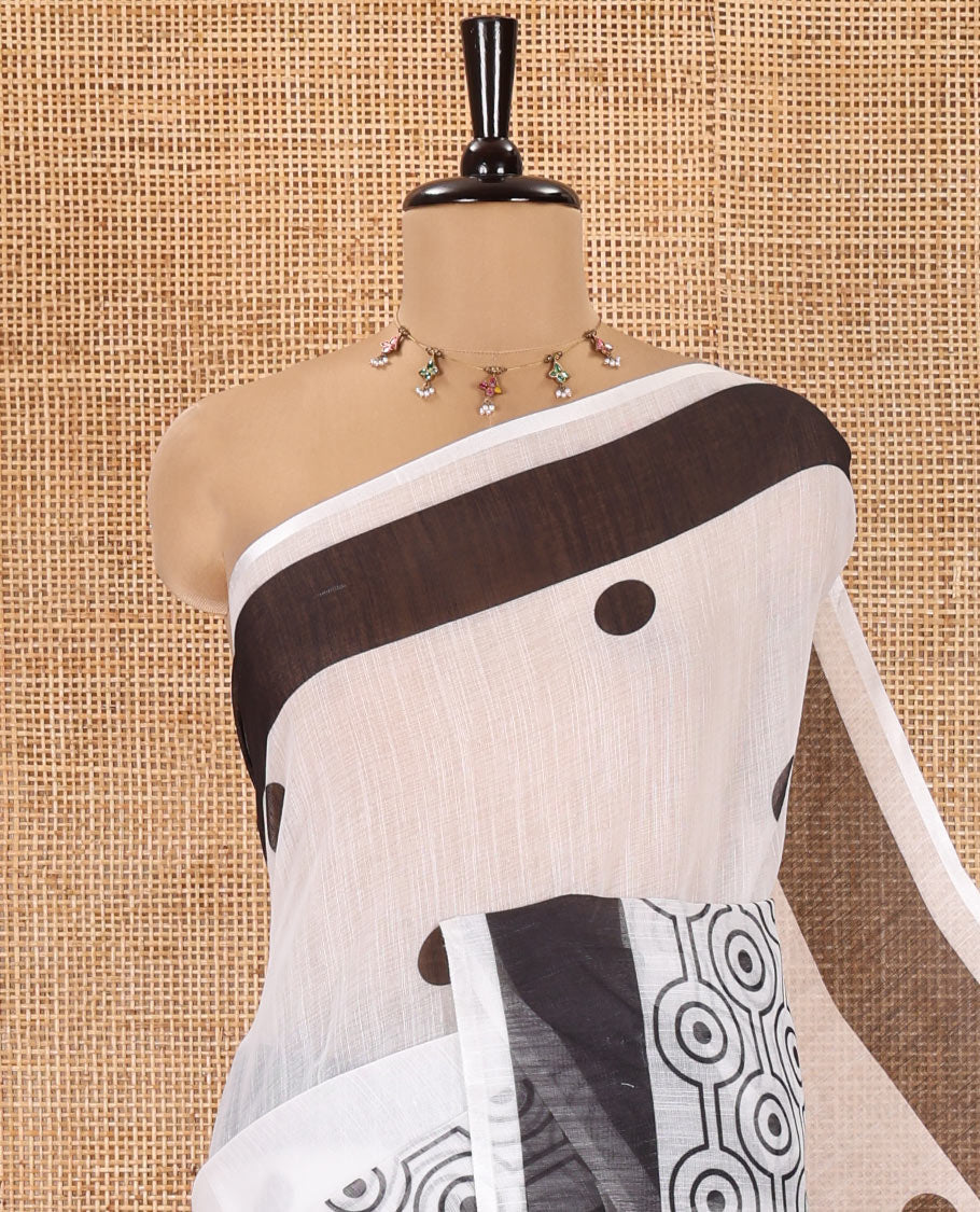 White and Black Linen Cotton Saree, Accentuated with Polka Dot Motifs All Over Its Body, Complemented by Contrast Geometric Patterned Border, a Self-Pallu and Paired with a Contrast Blouse