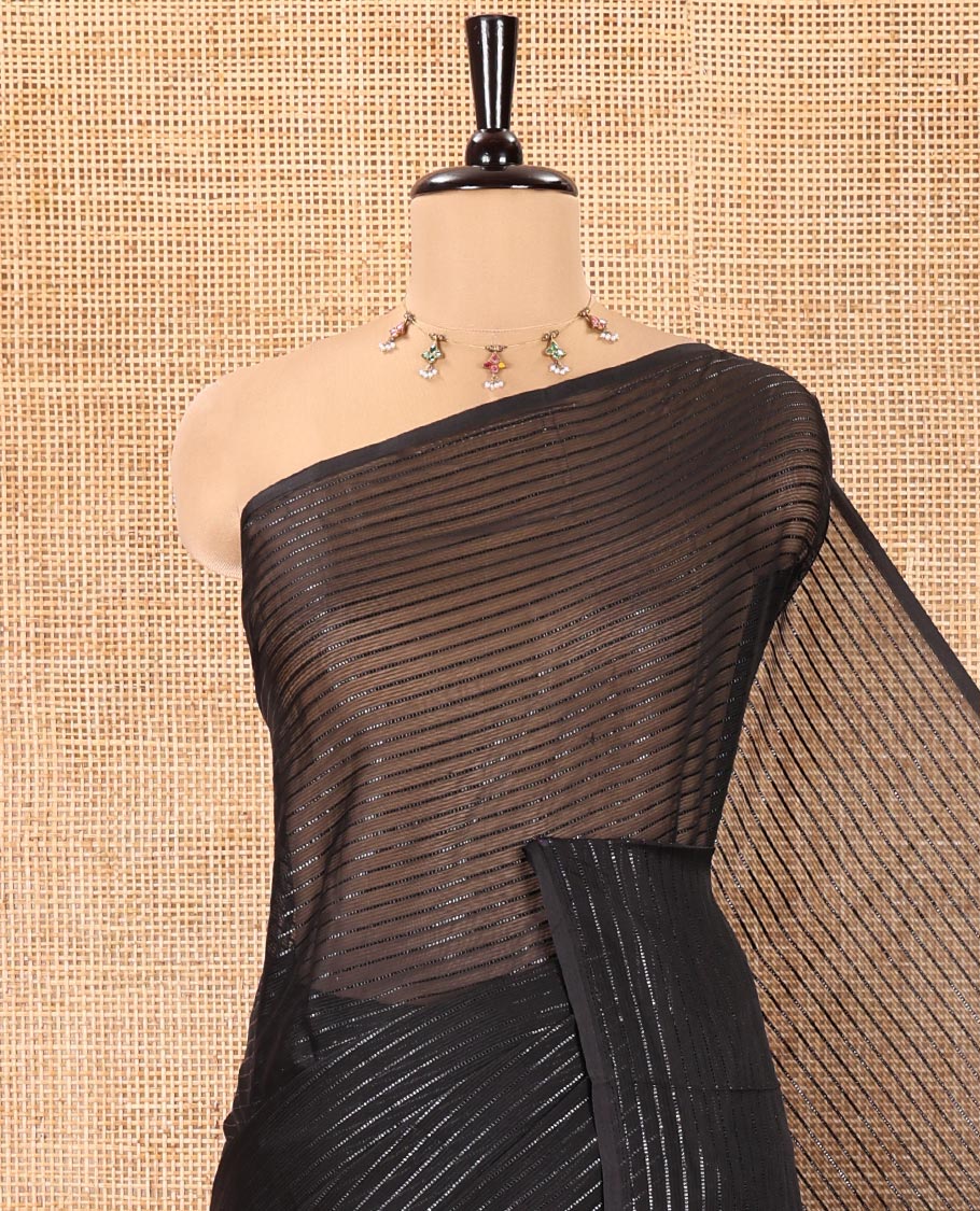 Borderless Black Chiffon Saree, Gleamed Up with Horizontal Stripes on Its Body, a Self-Pallu, and Comes Without a Blouse