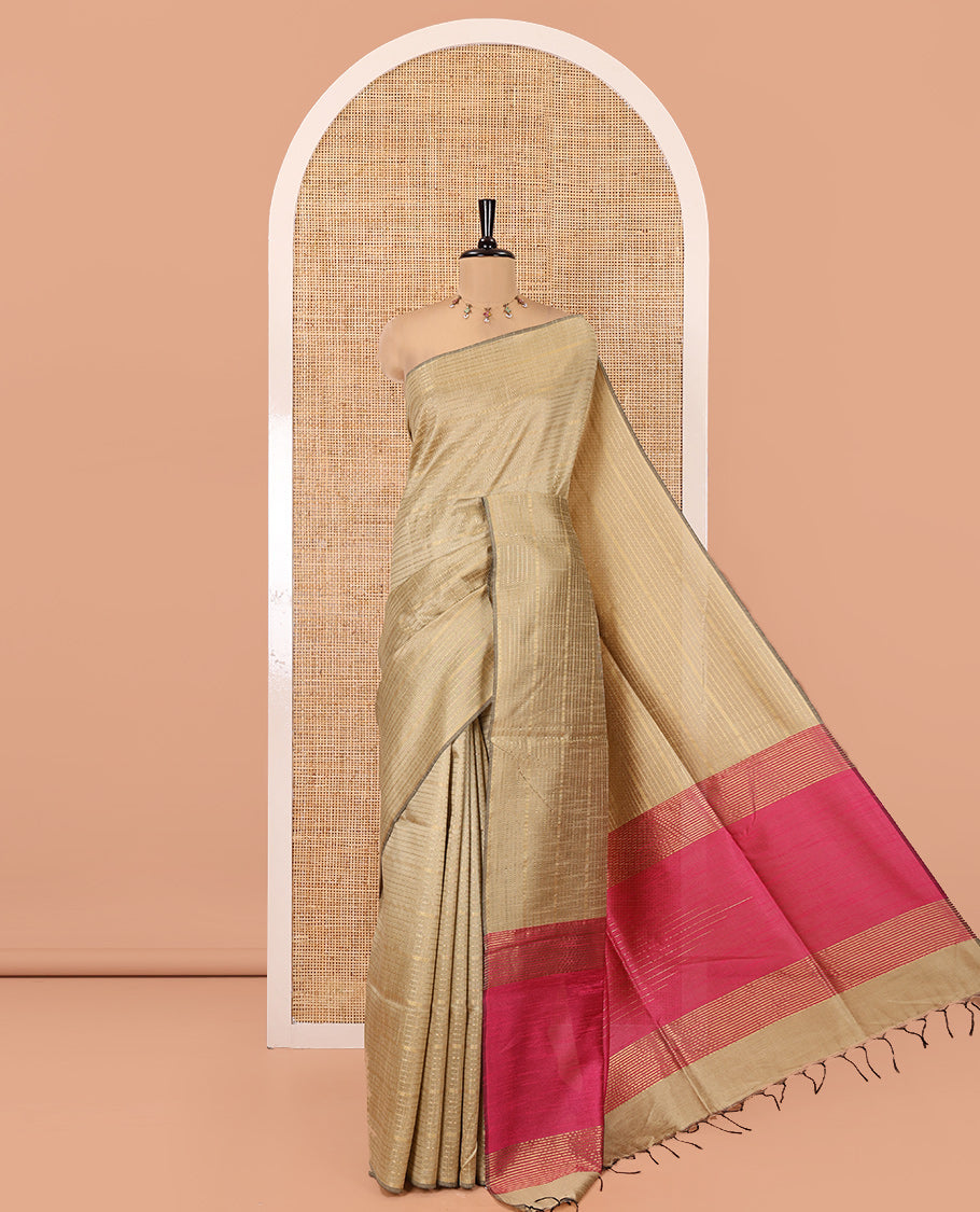 Borderless Chikku Semi-Raw Silk Saree, Subtly Sparkled with Muthu Stripes on Its Body, Complemented by a Contrast Zari Striped Pallu, and Paired with a Contrast Blouse