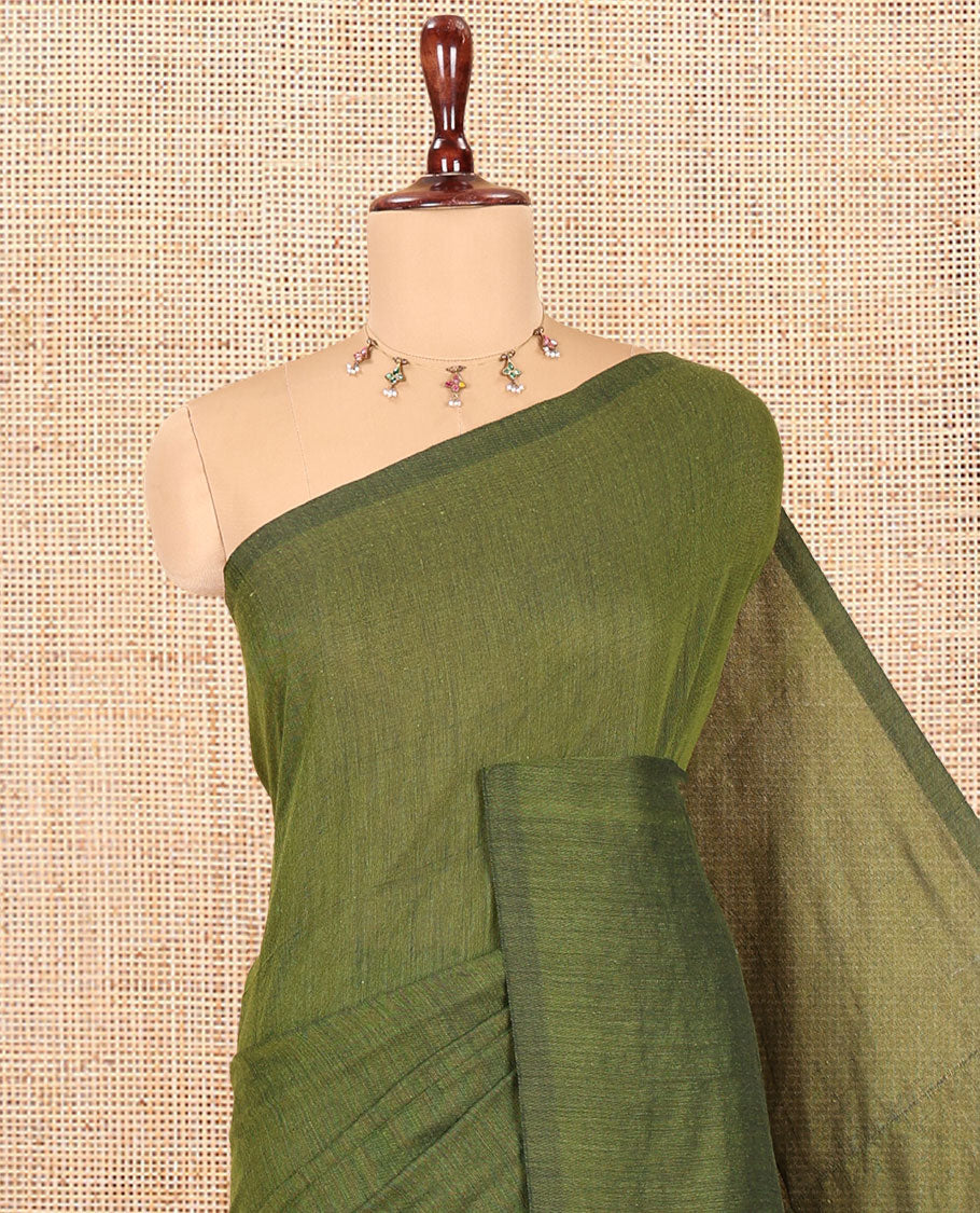 Borderless Olive Green Plain Khadi Cotton Saree, a Self-Pallu with Tassels, and a Matching Blouse