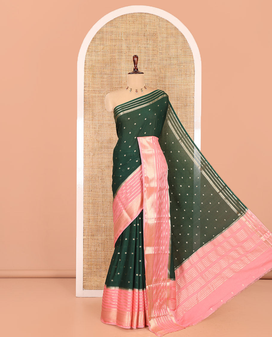 Green Art Crepe Saree Features Zari Buttas, Complemented by Contrast Traditional Zari Border, Zari Striped Pallu, and a Contrast Blouse