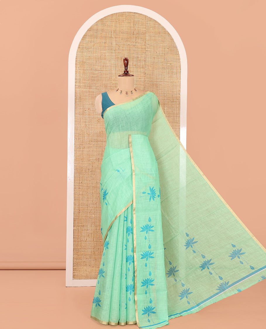 Borderless Green Linen Cotton Saree Features Lotus Print, a Self-Pallu, and a Matching Blouse