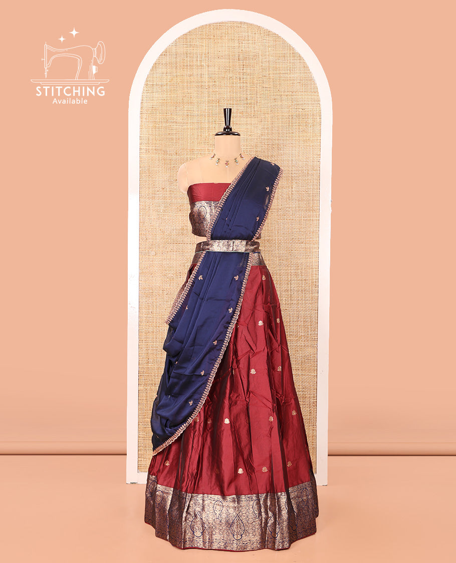 Maroon and Navy Blue Semi-Banarasi Half-Saree, Adorned with Zari Buttas on Its Skirt, Complemented by a Contrast Intricately Zari-Designed Border, Paired with a Matching Blouse, and a Contrast Satin Georgette Embroidered Scallop Dhavani