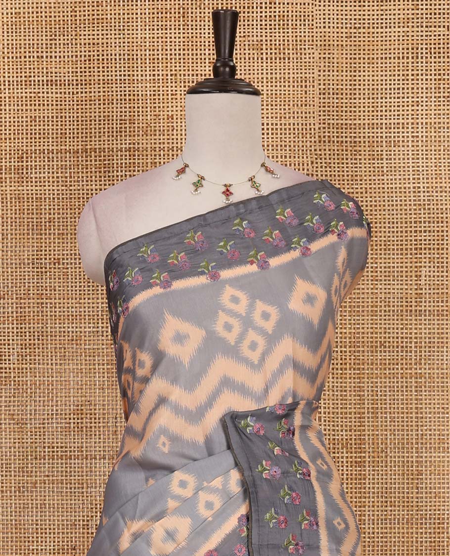 Grey pochampally ikkat style geometric printed fancy tussar saree, contrast floral motifs thread embroidered border, ikkat printed pallu, and plain blouse