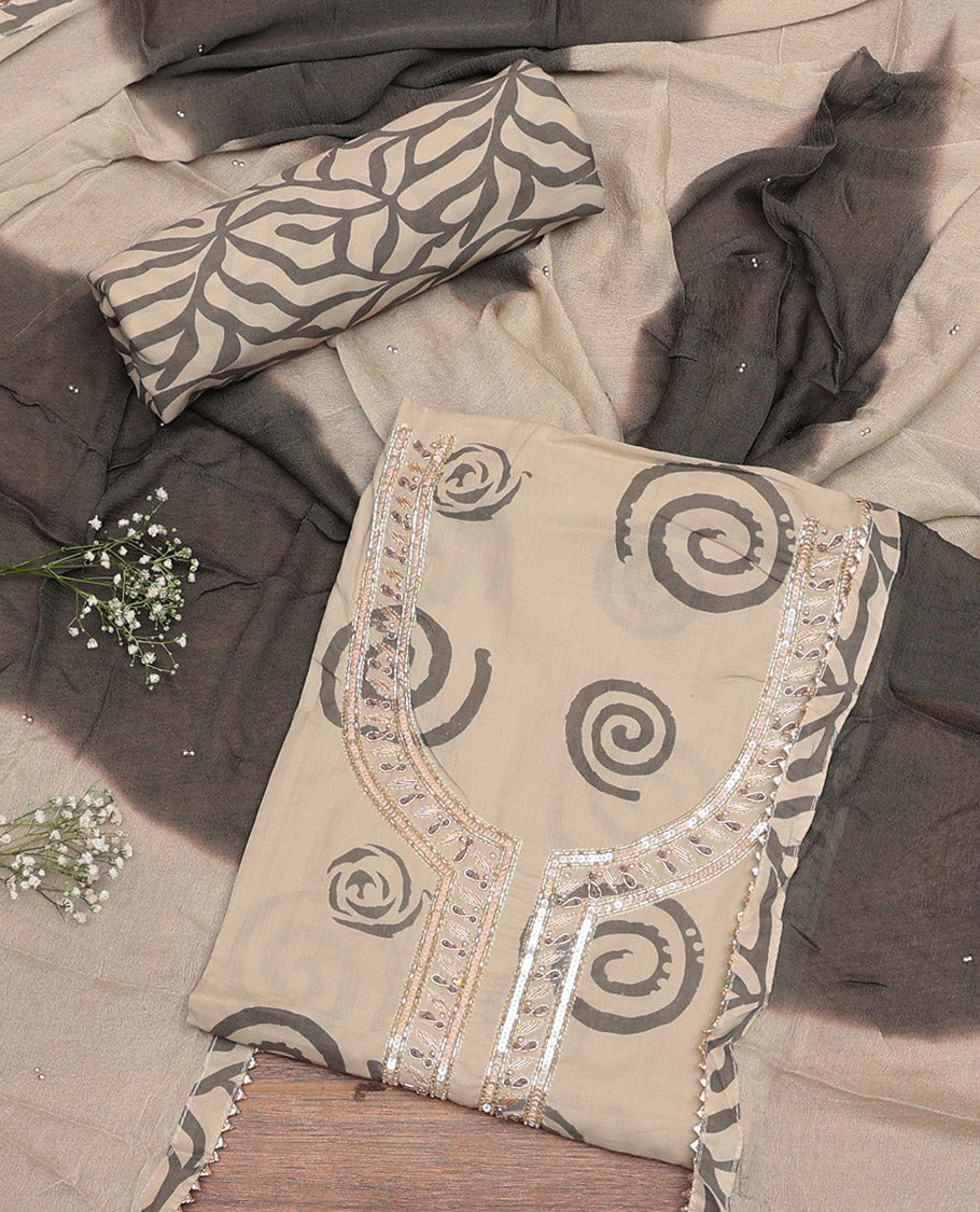 Chikku-Brown Material Churidar Set, Decorated with Spiral Motifs and Neck Embroidery Cotton Top, Printed Bottom, and Dual-Tone Dyed Chiffon Dupatta