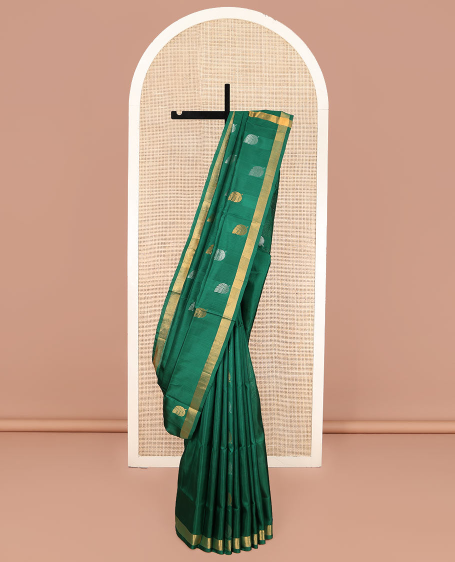 Green Uppada Silk Saree, Subtly Sparkled with Leaf Zari Buttas All Over Its Body, Subtle Bavanji Border, Pallu Steeped with Leaf Buttas, and Paired with a Matching Blouse