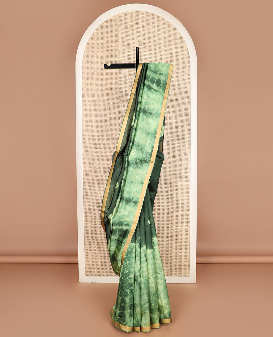 Green shibori printed banana pith saree, zari piping border, and zari striped pallu