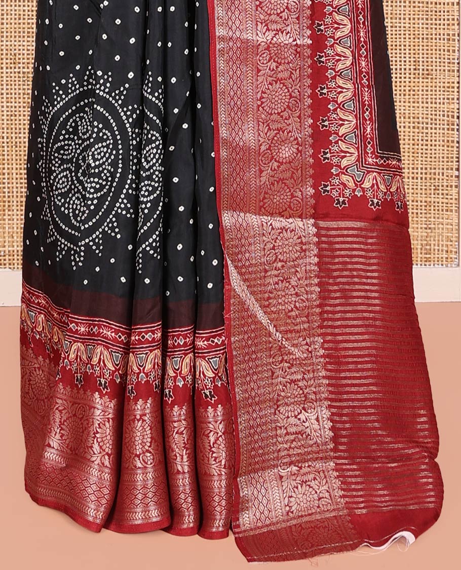 Black Dola Silk Saree, Detailed with Bandhani Dots on Its Body, Complemented by Contrast Border, Zari Striped Pallu, and Paired with a Contrast Blouse