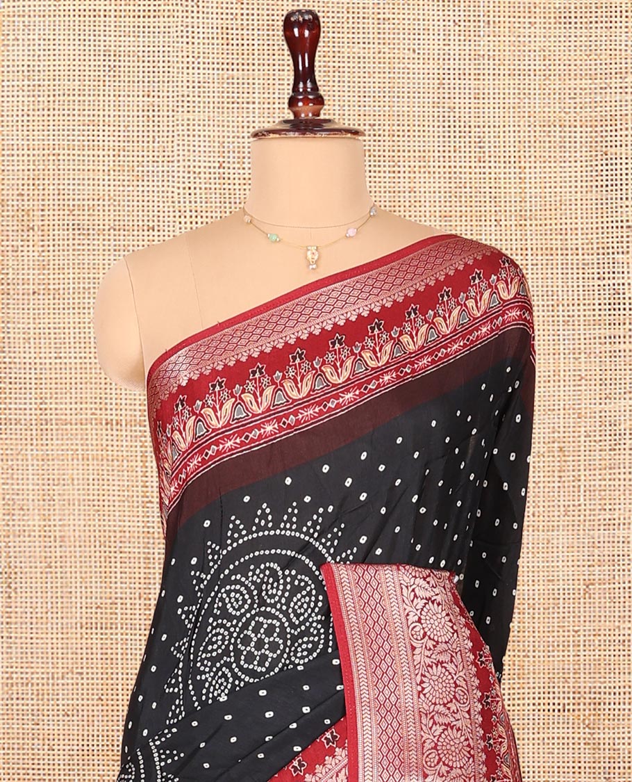 Black Dola Silk Saree, Detailed with Bandhani Dots on Its Body, Complemented by Contrast Border, Zari Striped Pallu, and Paired with a Contrast Blouse