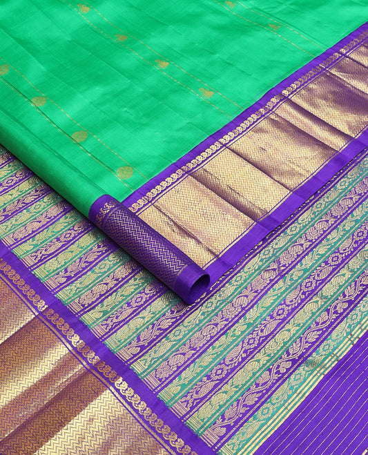 Green zari buttas Kanchipuram silksaree, contrast one-sided korvai border of manga mokku & vanki design & pallu of kodi visiry designs