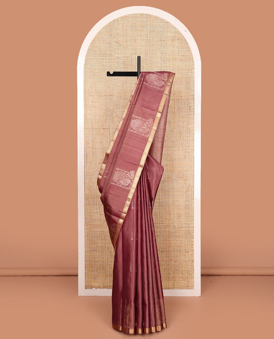 Pink mayil buttas soft silk saree, zari piping border, and pallu of intricate designs
