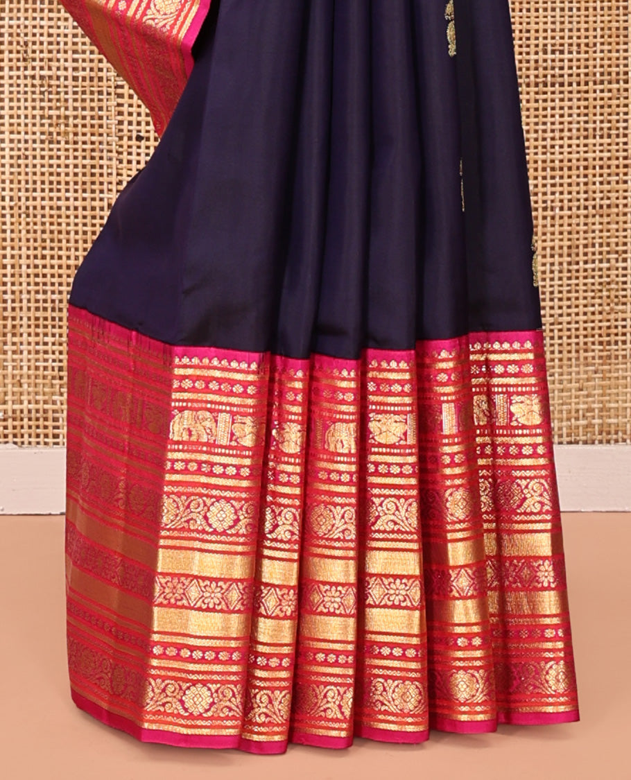 Blue Vasundhara Silk Saree, Embellished with Zari Buttas All Over Its Body, Complemented by a Contrast Border of Thilakam Mokku, Yaanai, Iruthalai Pakshi, and Kodi Visiry Designs, Grand Pallu, and Paired with a Contrast Blouse