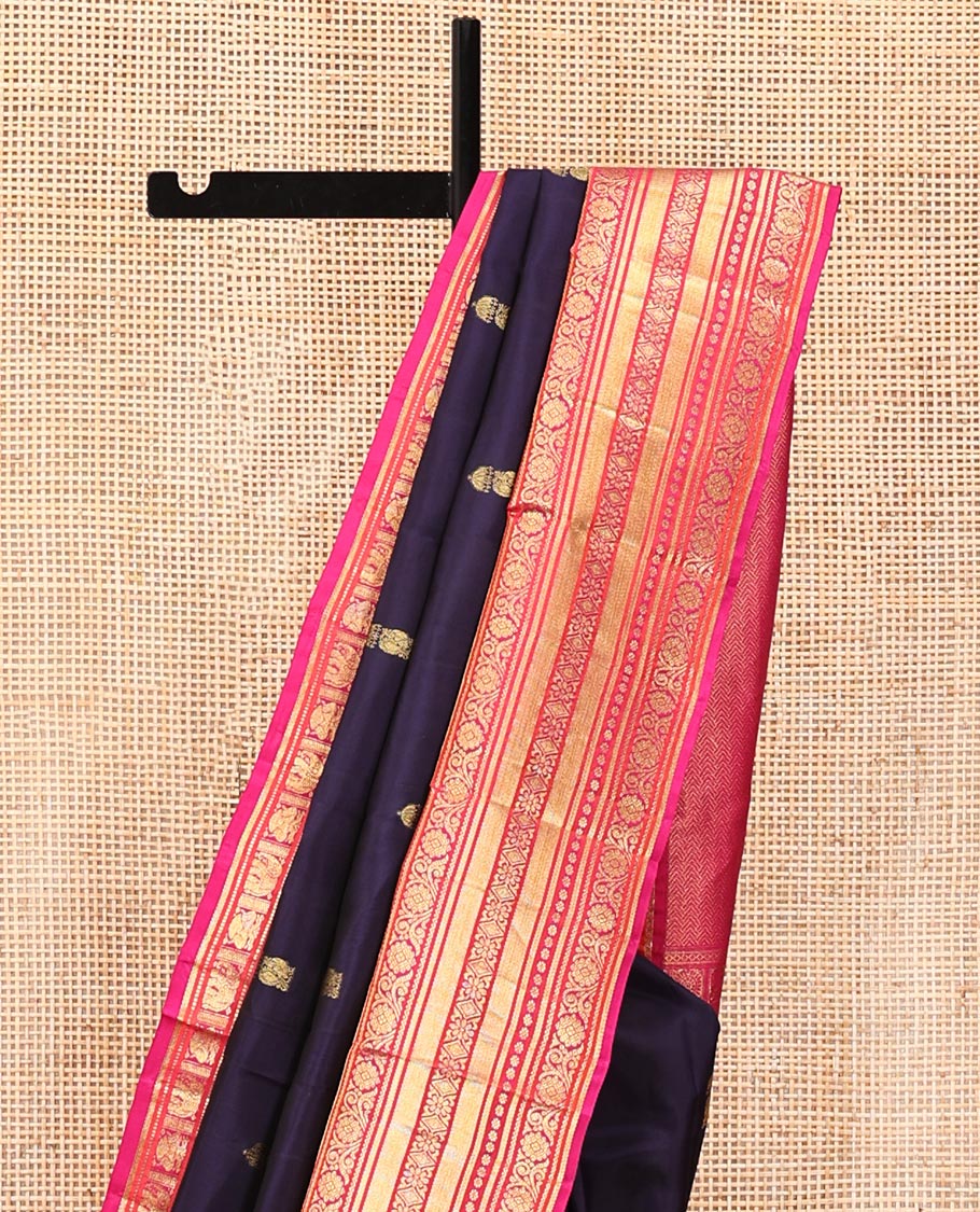 Blue Vasundhara Silk Saree, Embellished with Zari Buttas All Over Its Body, Complemented by a Contrast Border of Thilakam Mokku, Yaanai, Iruthalai Pakshi, and Kodi Visiry Designs, Grand Pallu, and Paired with a Contrast Blouse