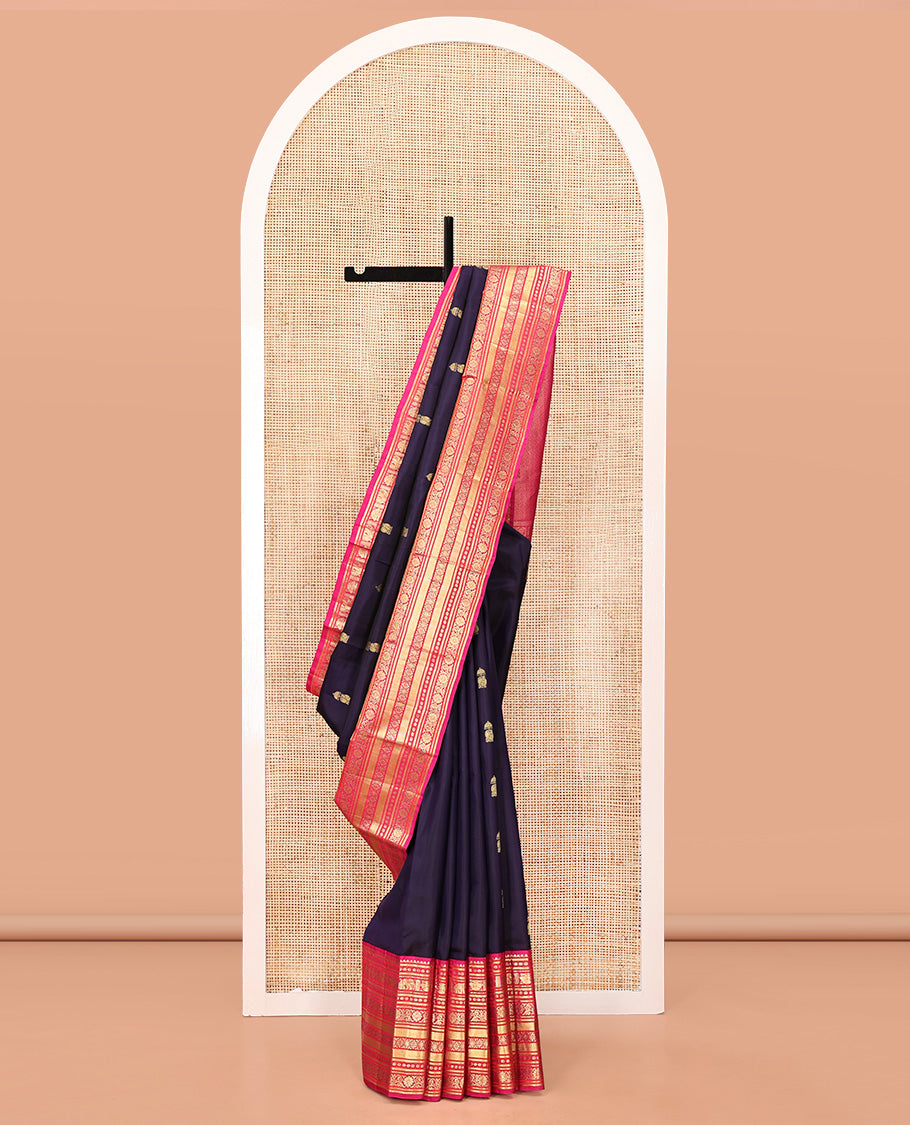 Blue Vasundhara Silk Saree, Embellished with Zari Buttas All Over Its Body, Complemented by a Contrast Border of Thilakam Mokku, Yaanai, Iruthalai Pakshi, and Kodi Visiry Designs, Grand Pallu, and Paired with a Contrast Blouse