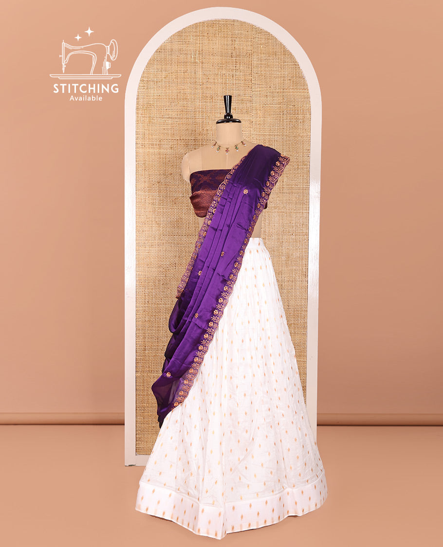 Cream and Purple Half-Saree Featuring Gold Zari Buttas Steeped Nylon Viscose Skirt, Complemented by a Contrast Jacquard Zari Design Blouse, and Comes with a Syska Georgette Embroidered Scallop-Bordered Dhavani
