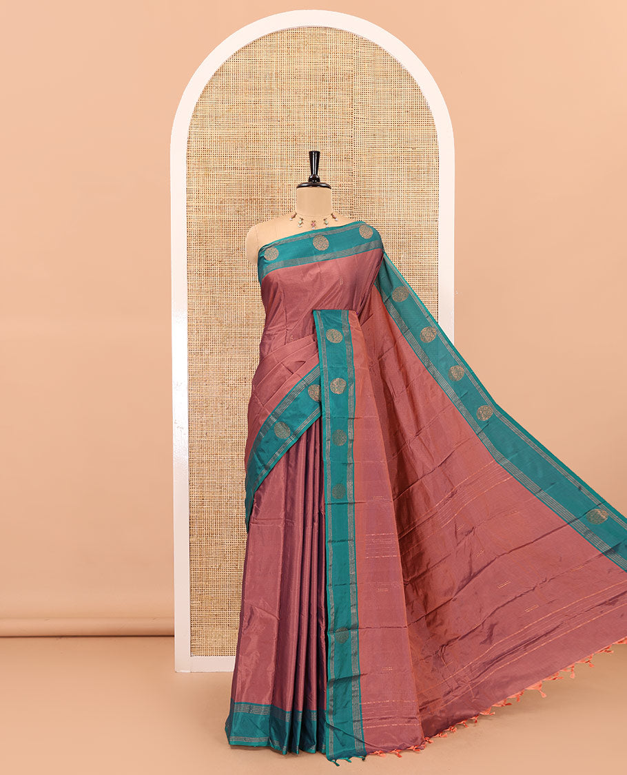 Peach zari buttas semi-soft silk saree, contrast zari buttas and striped border, striped pallu, and a plain blouse