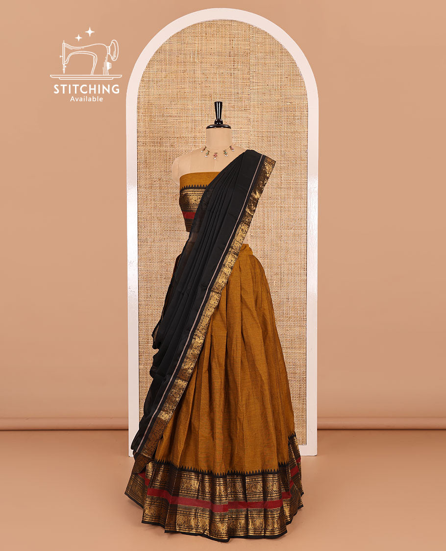 Mustard-black sungudi cotton half-saree, plain with contrast traditional zari varisai pettu bordered skirt, a matching blouse, and a zari bordered dhavani