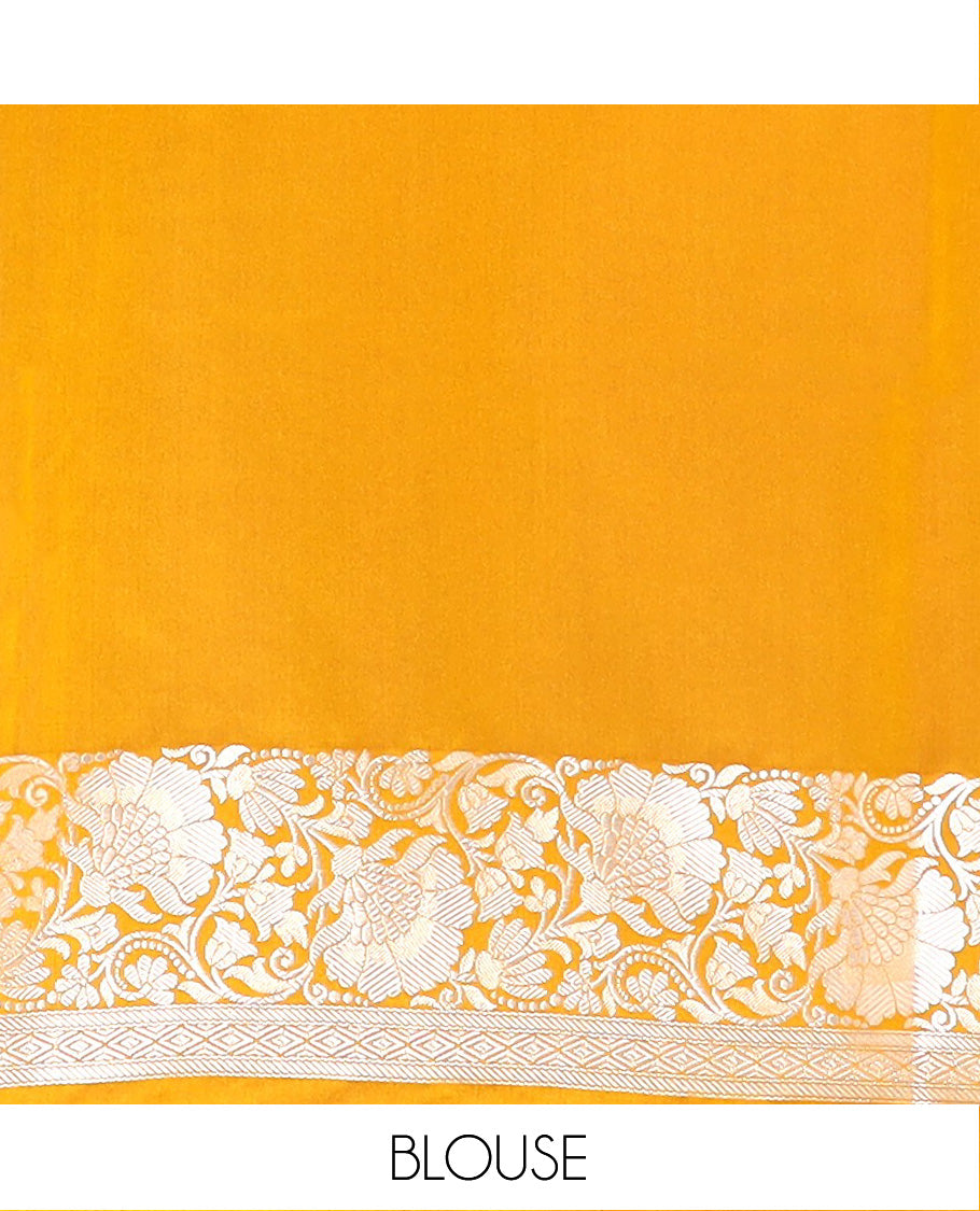 Yellow Semi-Banaras Satin Saree Subtly Sparkled with Zari Buttas, Self-Border Gleamed Up with Floral Creeper Designs, Pallu Creatively Woven of Lotus Motifs, and Paired with a Matching Blouse