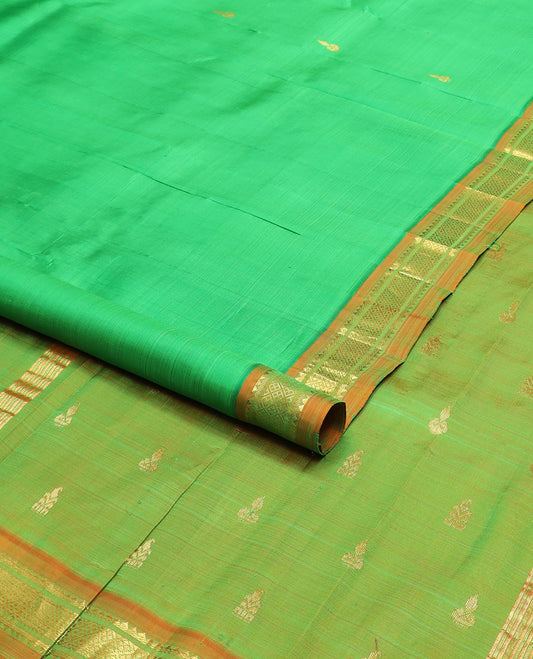 Green zari buttas kanchipuram silksaree, contrast one-sided border of thazampoo rekku,banaras & jaal design & zari design pallu