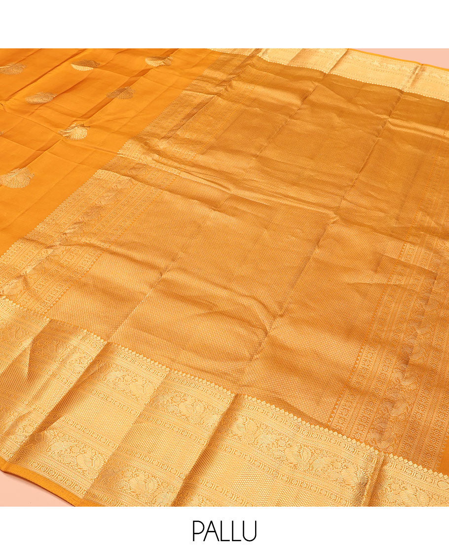 Yellow Vasundhara Lite Silk Mix Saree, Decorated with Zari Buttas, Highlighted by a Zari Border of Thilakam Mokku, Muthu, Kamalam, Mayil, Yaanai, Rettai Neli, and Mayil Kann Designs, Pallu of Mayil Kann Designs, and Paired with a Matching Blouse