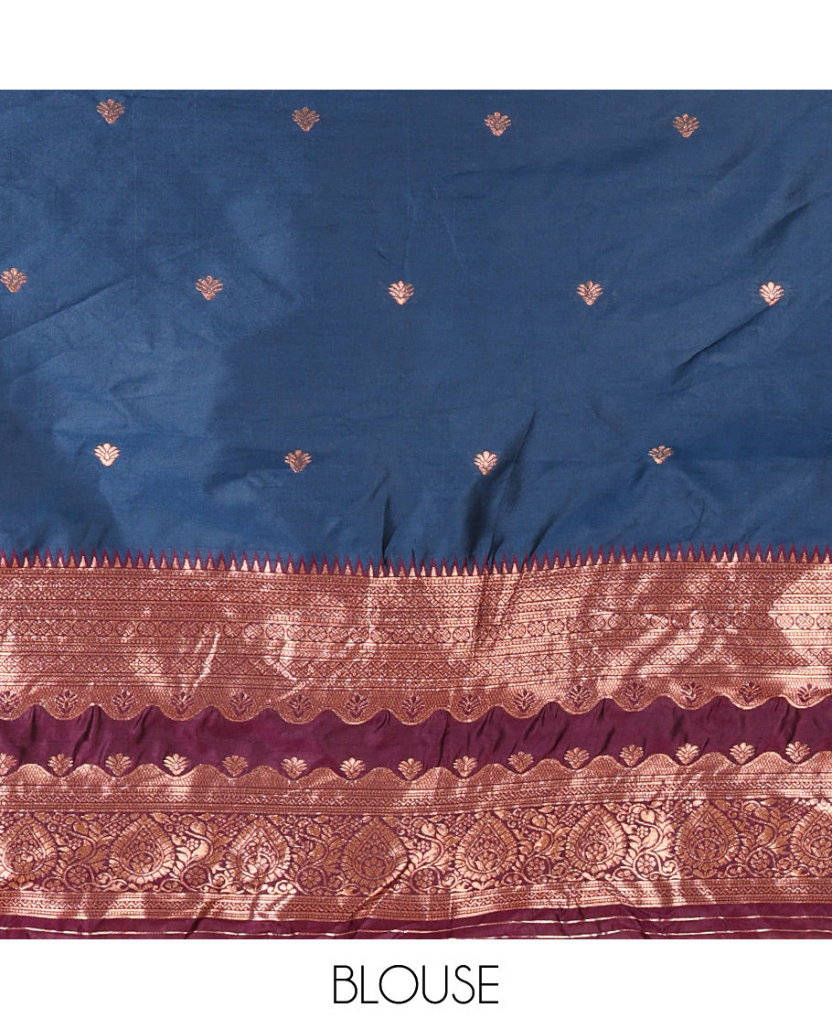 Blue-Purple Semi-Banarasi Half-Saree Enriched with Zari Buttas on Its Skirt, Complemented by a Contrast Traditional Zari Temple Rettai Pettu Border, Paired with a Matching Blouse, and a Satin Georgette Embroidered Scallop Dhavani