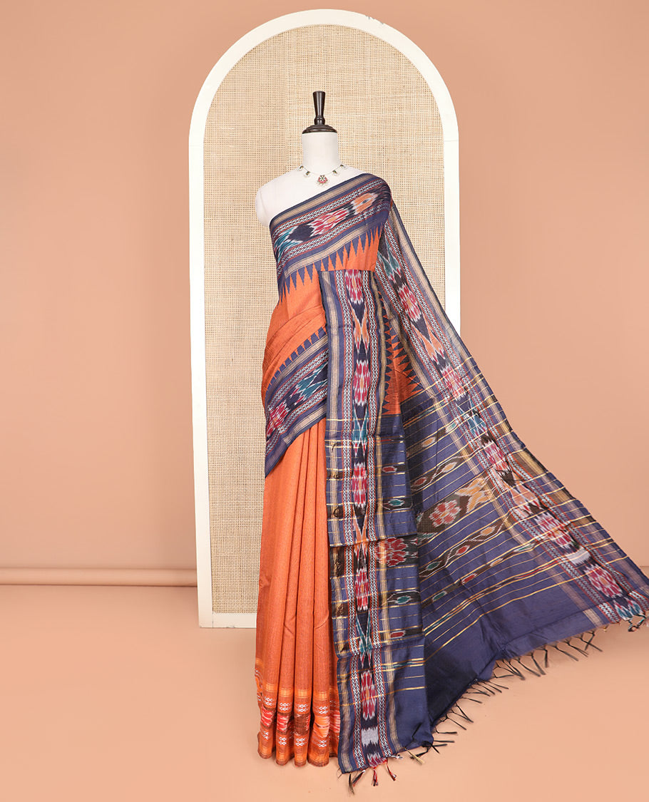 Orange Plain Dupion Silk Saree, Adorned with a Contrast Temple Border of Geometric Patterns and Ikkat Weave, Pallu Depicting Floral Ikkat Designs, and Paired with a Contrast Blouse