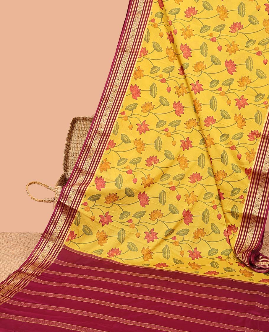 Yellow pichwai-style floral vine printed semi-banaras printed saree, contrast traditional design border & striped pallu