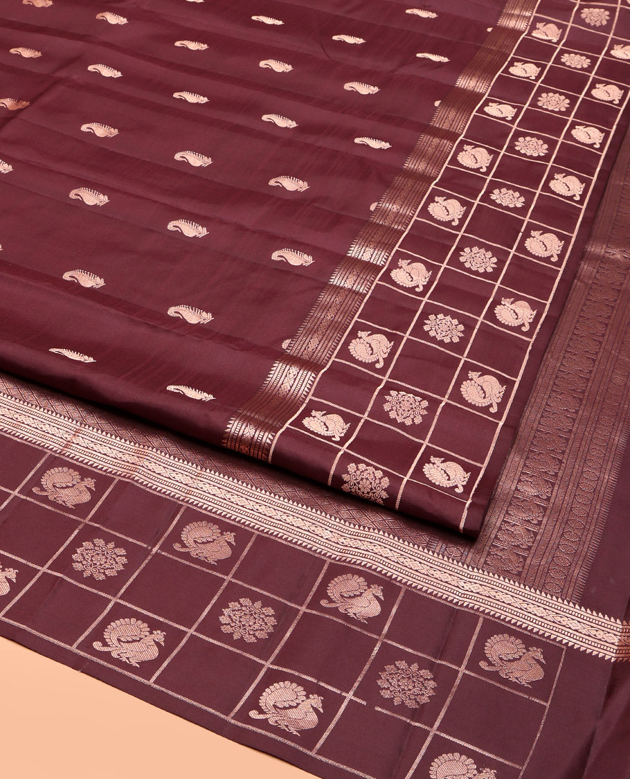 Brown Vasundhara Silk Saree, Artfully Detailed with Zari Buttas, Highlighted by a Zari Border of Rekku, Muthu, Jada Nagam, and Butta Enclosed Checks, Jaal Pallu, and a Matching Blouse
