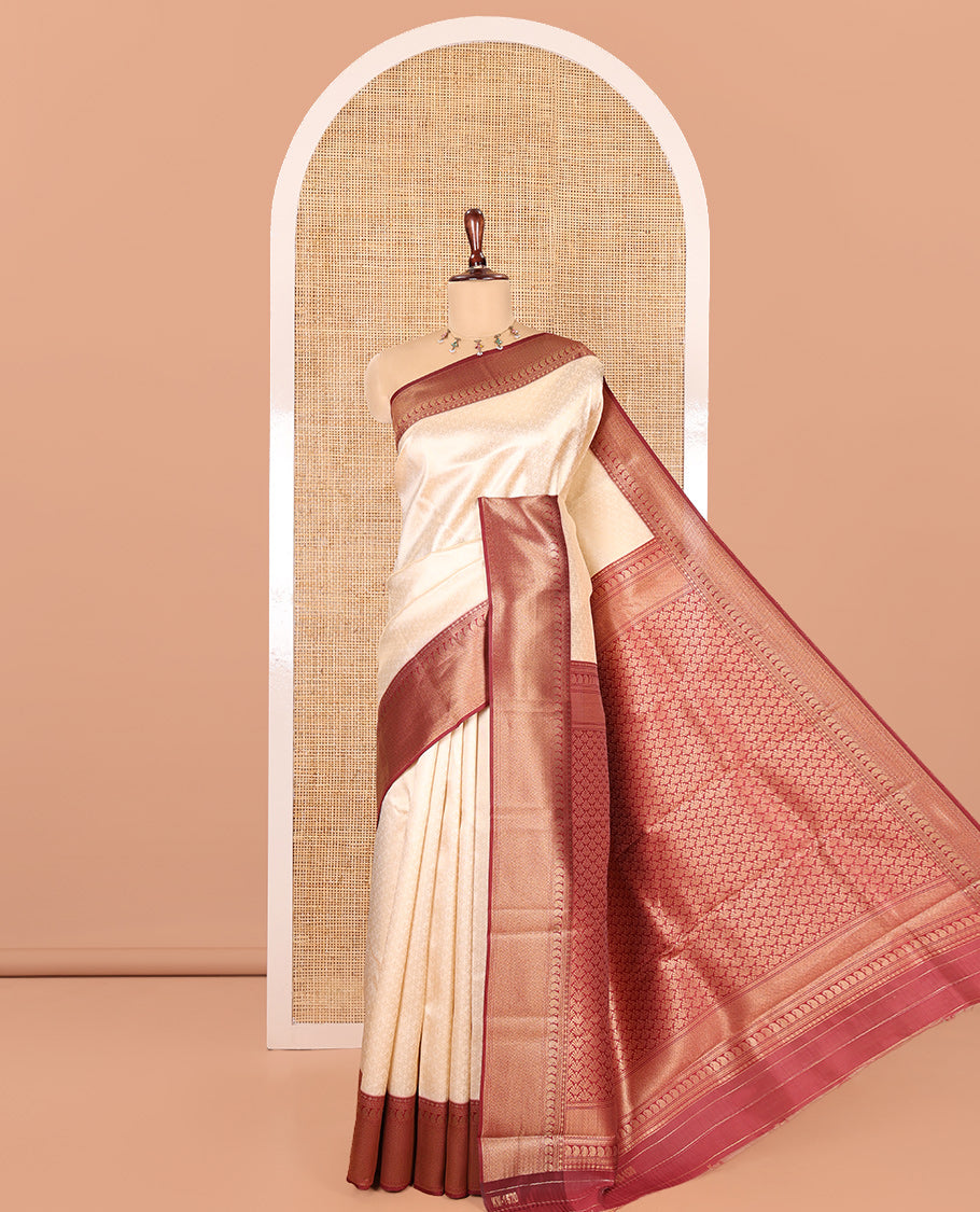 Cream-Maroon Embossed Art Kanchi Silk Saree, a Contrast Traditional Zari Border, Intricate Pallu, and a Contrast Blouse