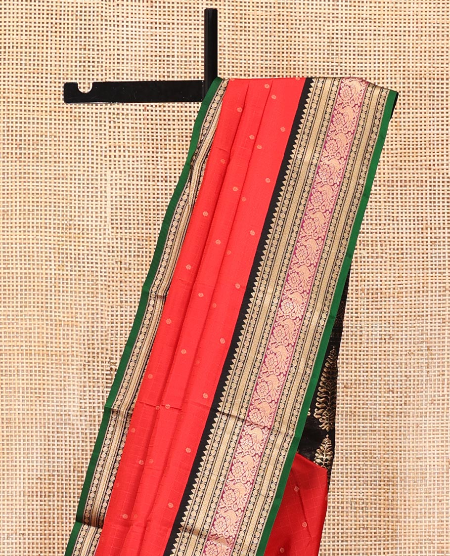 Red Vasundhara Silk Saree, Sparsely Woven with Zari Buttas All Over Its Body, Complemented by a Contrast Border of Rekku, Muthu, Poun, Kathir, and Mayil Designs, Beautifully Bedecked Pallu, and Paired with a Contrast Blouse