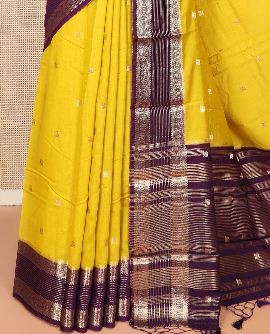 Yellow Assam Silk Saree Sparsely Woven with Peacock Buttas, Complemented by Contrast Traditional Zari Design Border, Pallu Highlighted with Zari Stripes, and Paired with a Contrast Blouse