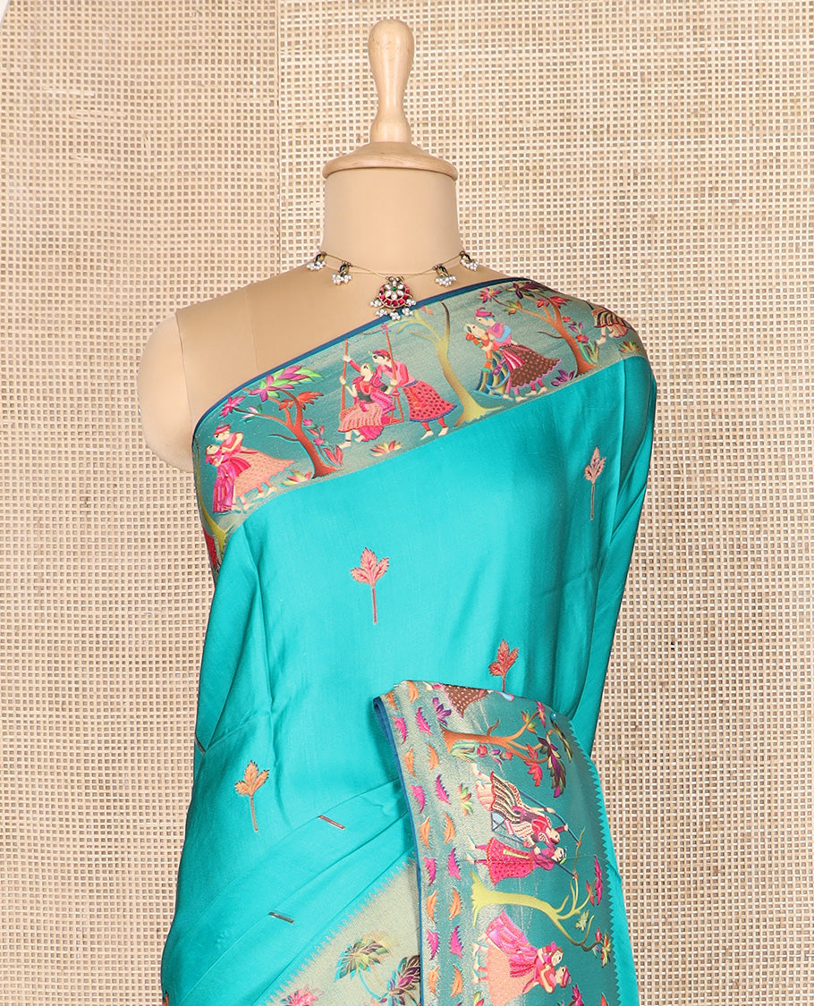 Blue unique motifs printed dola silk saree, gleaming zari border, and pallu of Mughal-style man and women motifs