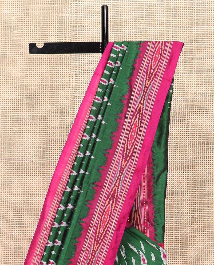 Green Ikkat Silk Saree Adorned with Geometric Patterns, Complemented with Contrast Ikkat-Textured Border, and Pallu Features Stripes and Ikkat Texture