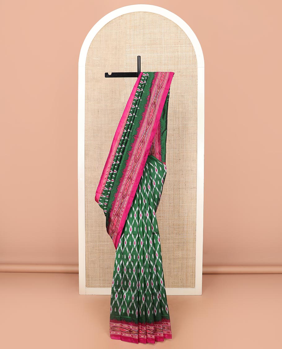 Green Ikkat Silk Saree Adorned with Geometric Patterns, Complemented with Contrast Ikkat-Textured Border, and Pallu Features Stripes and Ikkat Texture