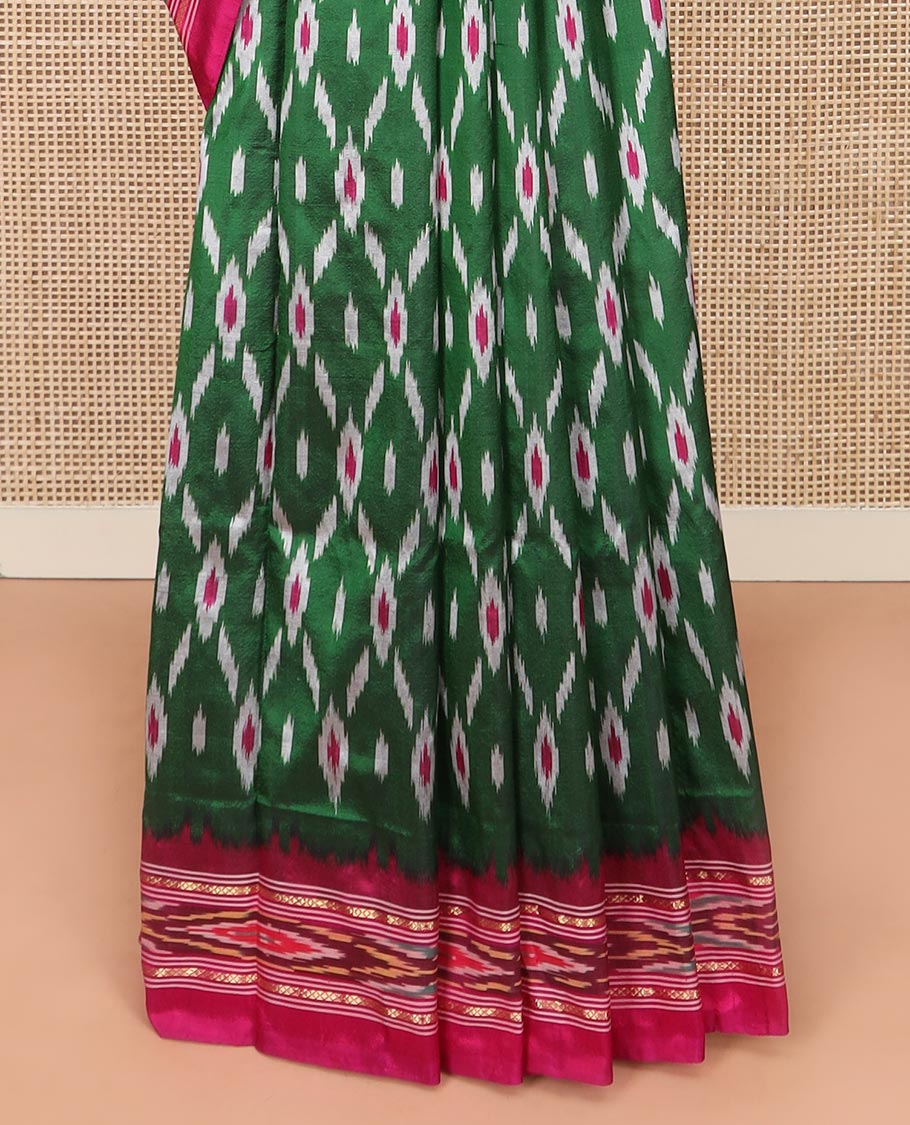 Green Ikkat Silk Saree Adorned with Geometric Patterns, Complemented with Contrast Ikkat-Textured Border, and Pallu Features Stripes and Ikkat Texture