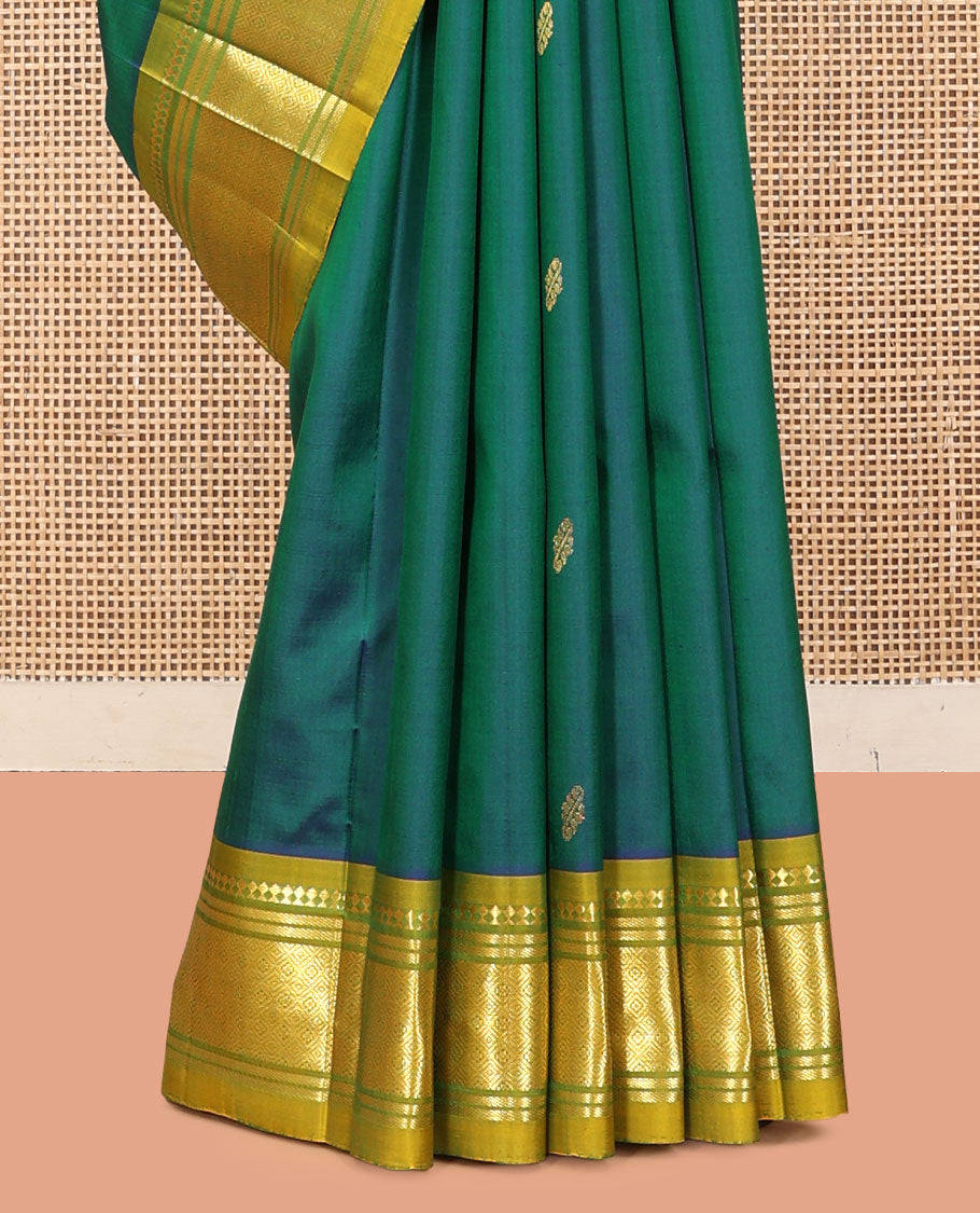 Green Kanchipuram Silk Saree, Detailed with Zari Buttas, a Contrast One-Sided Border of Panner Sombu, Banaras, and Jaal Designs, a Zari Design Pallu, and No Blouse