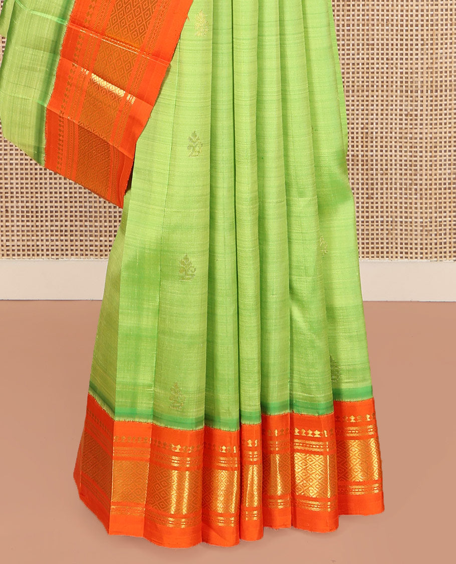 Green Kanchipuram Silk Saree, Finely Crafted with Zari Buttas on Its Body, Complemented by a Contrast One-Sided Korvai Border of Panner Sombu, Banaras, Muthu, and Mayil Kann Designs, Pallu Steeped with Zari Designs, and Comes Without a Blouse