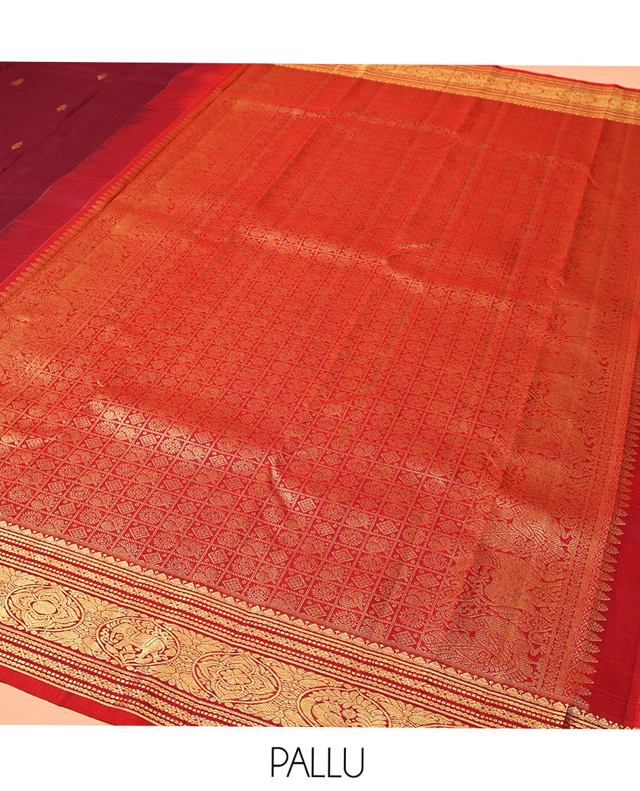 Maroon Kanchipuram Silk Saree, Bedecked with Zari Buttas All Over Its Body, Complemented by a Contrast Border of Neli, Muthu, Cross Kamalam, and Mayil Designs, Pallu of Butta Enclosed Checked Designs, and Paired with a Contrast Blouse