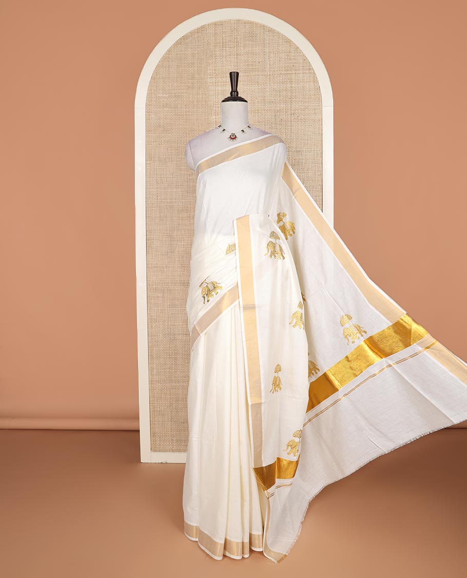 Cream elephant motifs embroidered Kerala cotton saree, zari border, and elephant motifs embroidered pallu