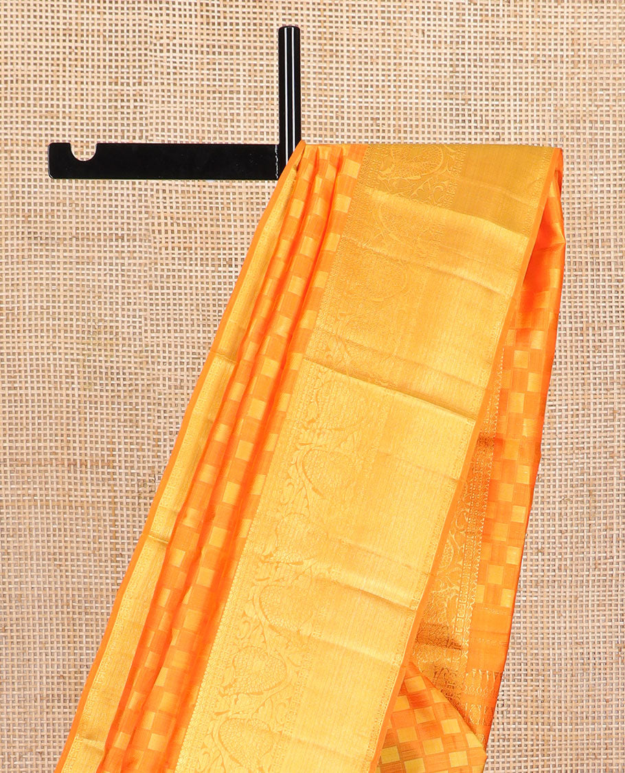 Orange checkered silk saree with self zari border of thilakam mokku, poo chakram, banaras design & zari design pallu