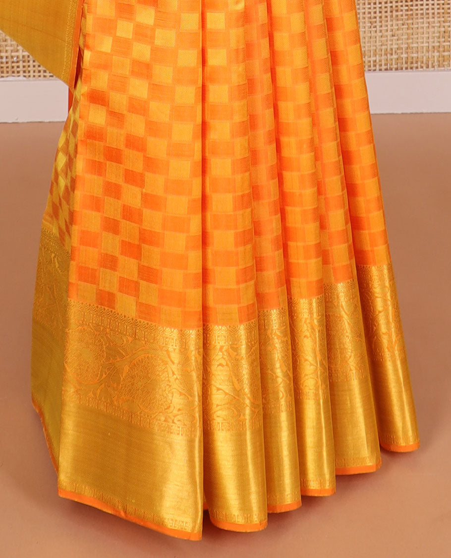 Orange checkered silk saree with self zari border of thilakam mokku, poo chakram, banaras design & zari design pallu