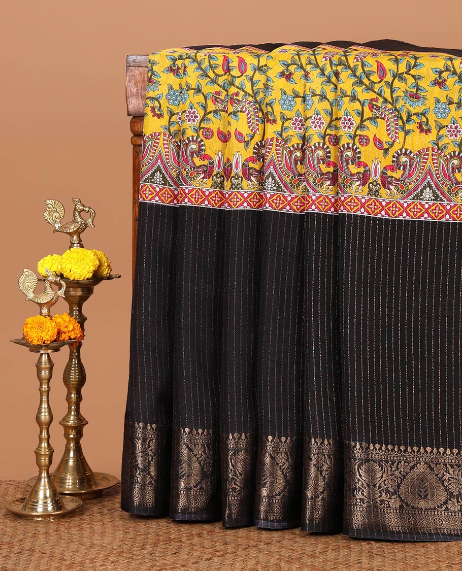 Black and gold dola silk saree with zari stripes and kalamkari-theme motifs printed on its center of the body, golden zari jacquard border & zari design blouse